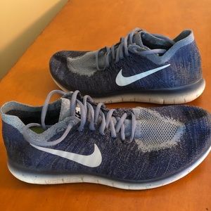 Blue Nike tennis shoes